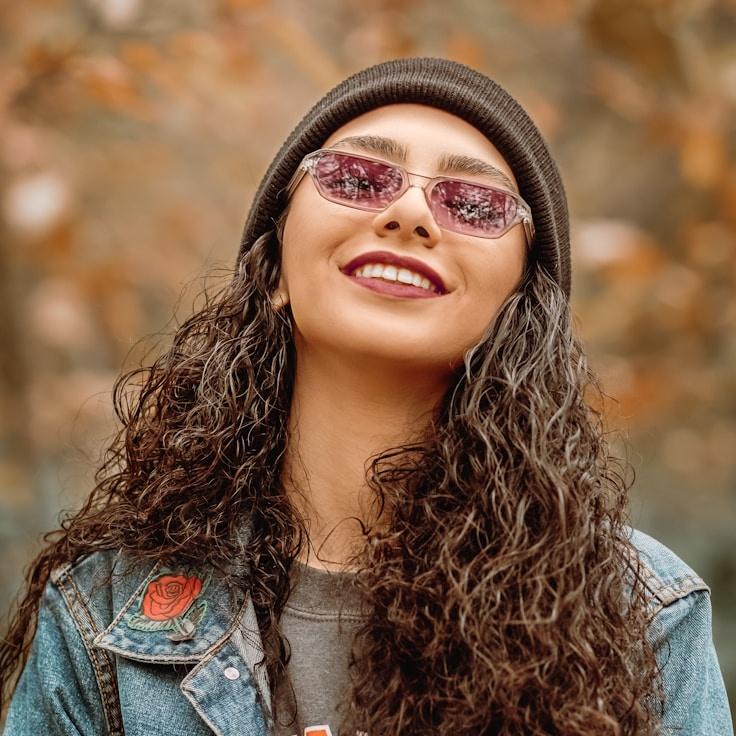 Kaveri Mehta, Lead Design Curator at Timber Bridge Cliff, reviewing corporate floral arrangements